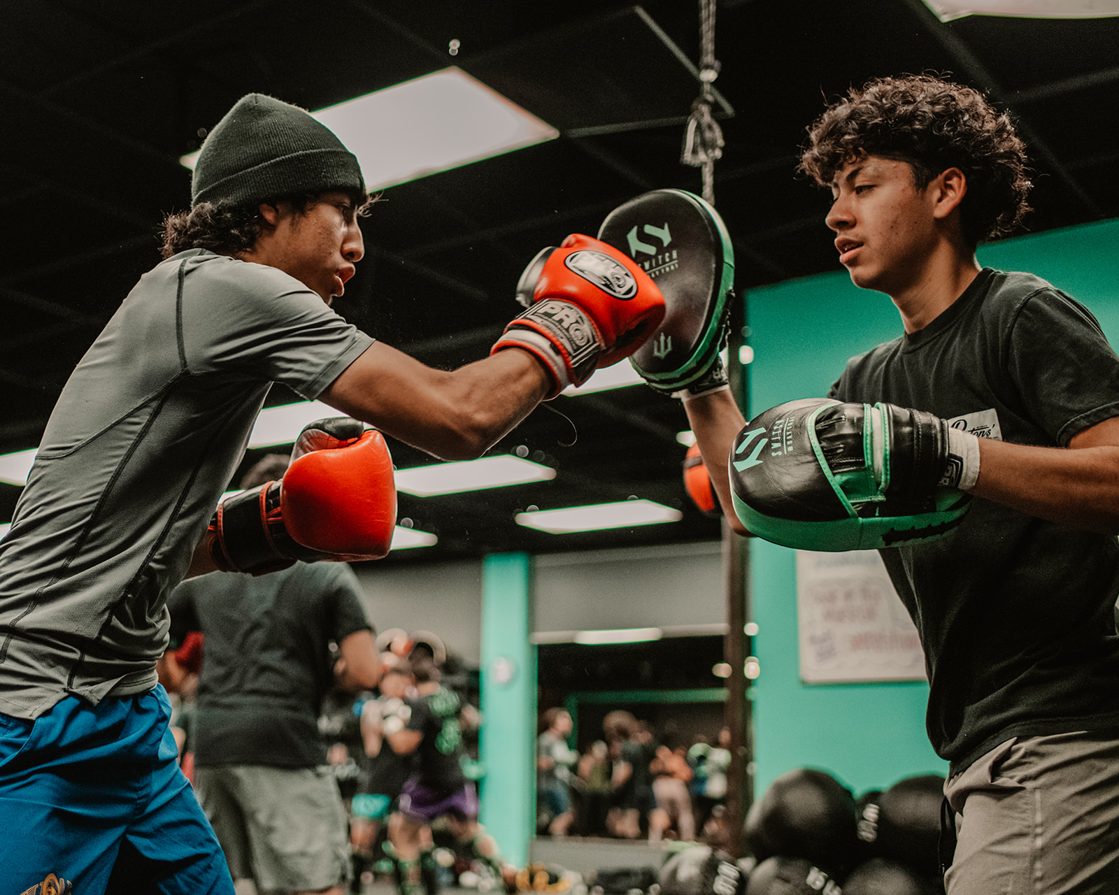 Two boxers working pad drills at Switch Fitness San Diego.
